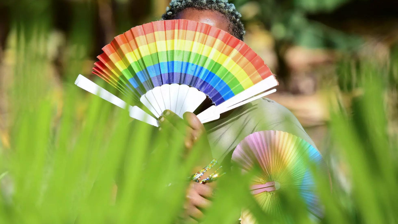 Quin Karala, 29, a member of the LGBTQ community poses for a picture with rainbow colours in Kulambiro suburb of Kampala, Uganda April 4, 2023.  (Photo/Reuters)