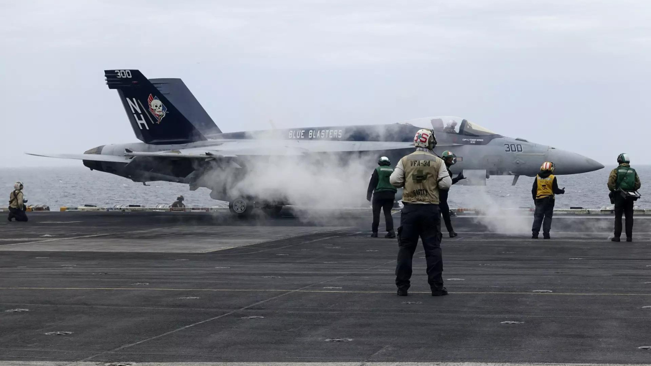 A F-18E fighter jet prepares to take off from USS Theodore Roosevelt aircraft carrier on Thursday April 11, 2024, during a three-day joint naval exercise by the US, Japanese and South Korea at the East China Sea amid tension from China and North Korea (Reuters photo)