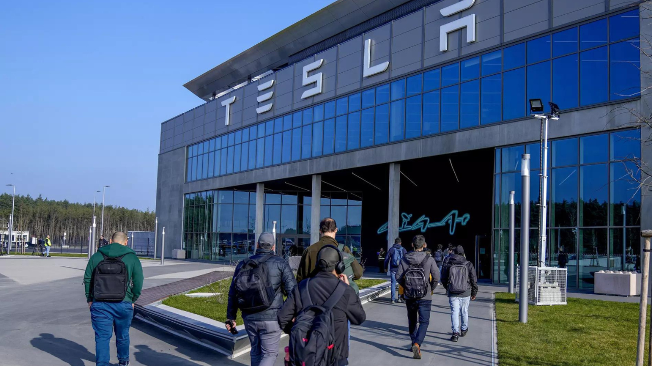 People walk to the Tesla Gigafactory for electric cars in Gruenheide near Berlin, Germany, March 13, 2024. (Photo/AP)