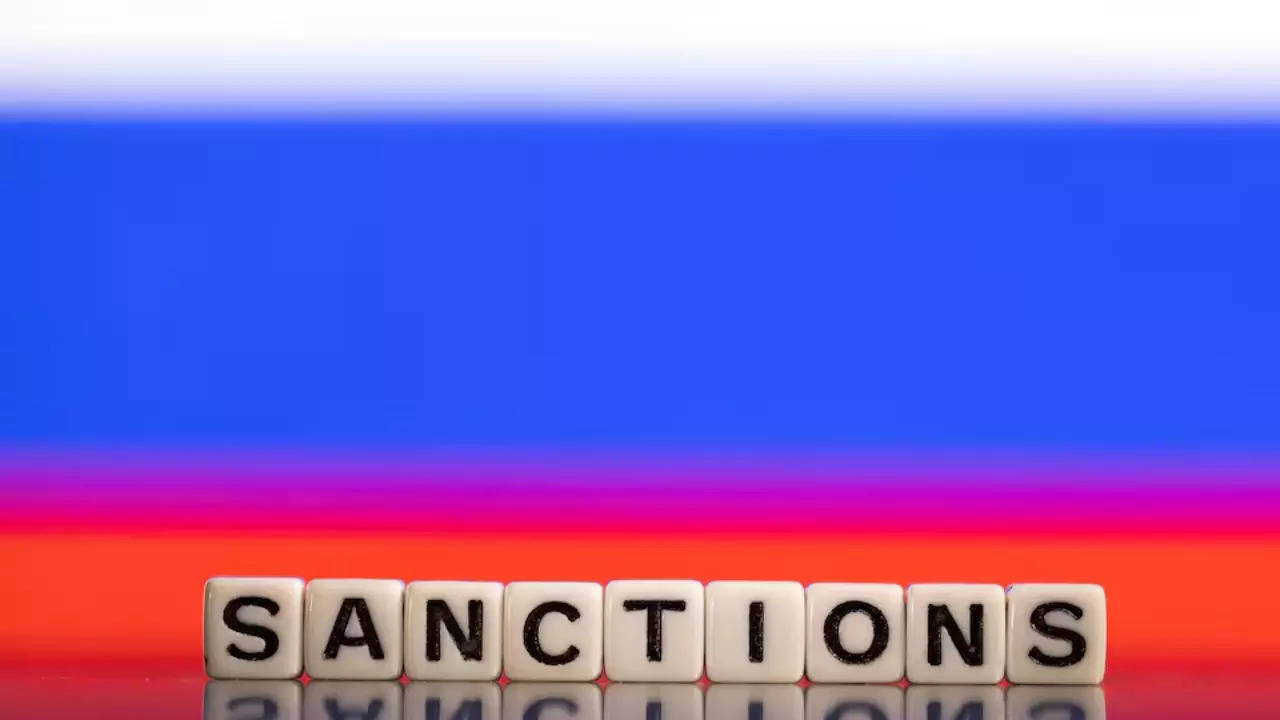Plastic letters arranged to read "Sanctions" are placed in front of Russian flag colors in this illustration taken February 25, 2022. REUTERS/Dado Ruvic/Illustration/ File photo