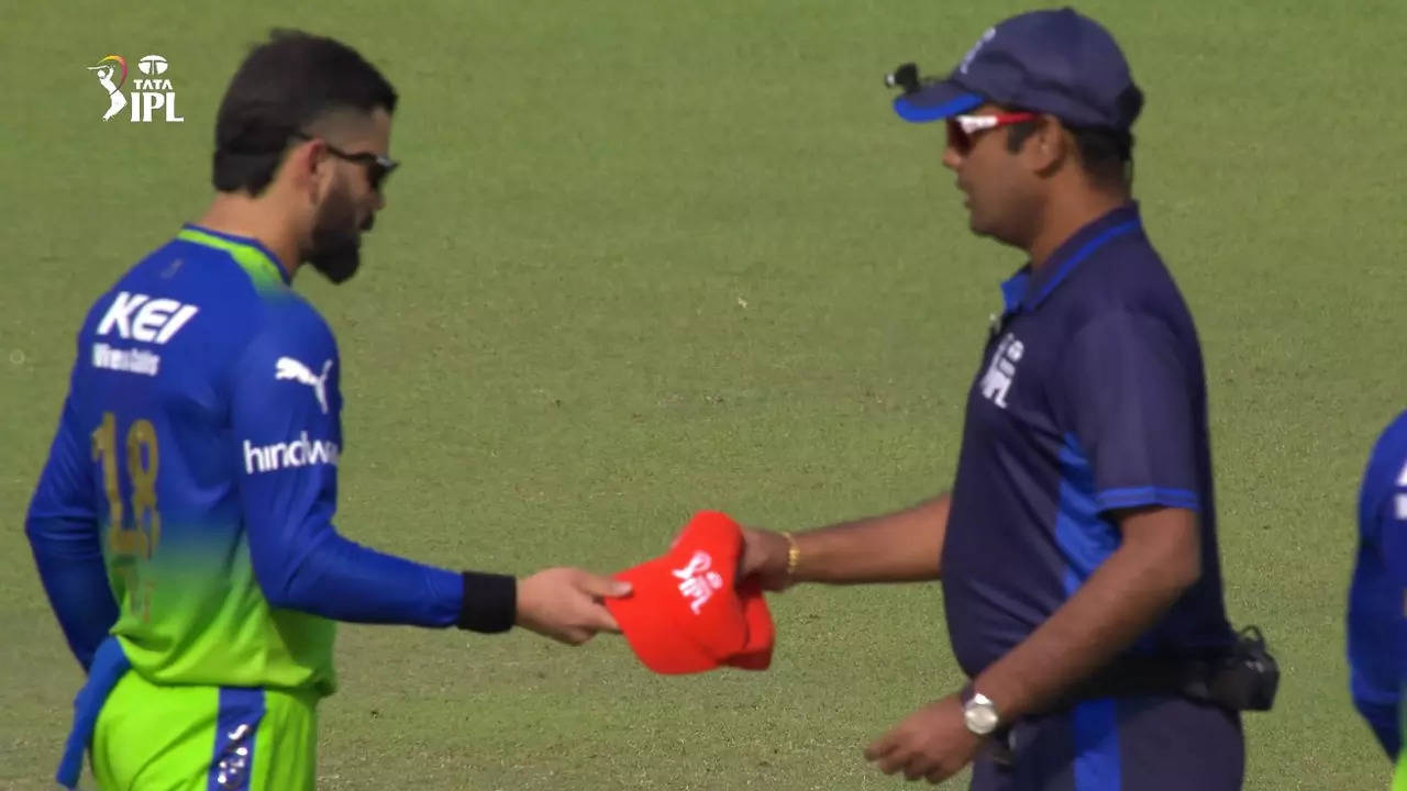 Watch: Loud cheers as 'bowler' Kohli hands his cap to umpire