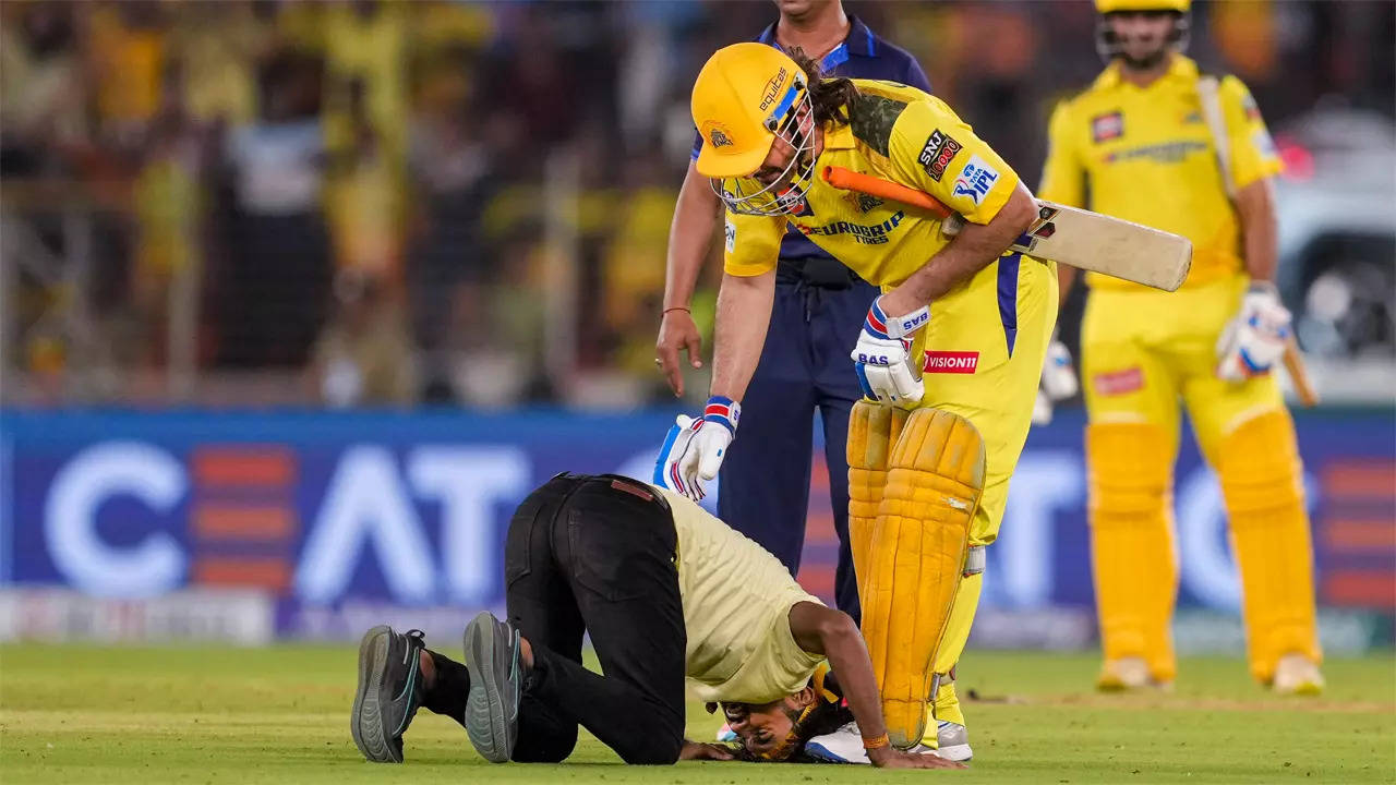 Watch: Fan breaches security, bows down in front of Dhoni