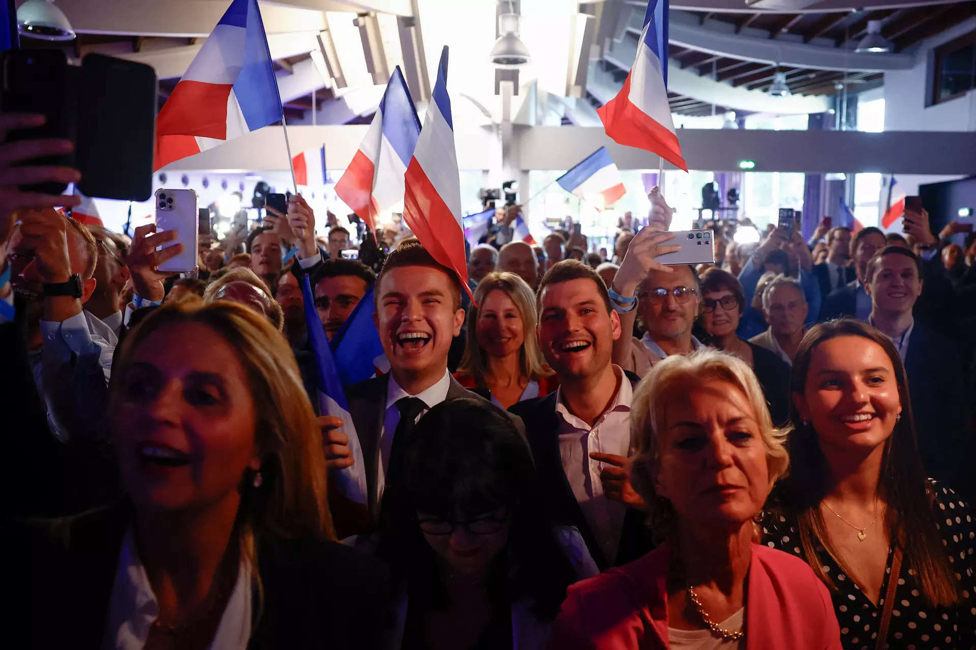 France's far right National Rally still leading ahead of election, poll shows