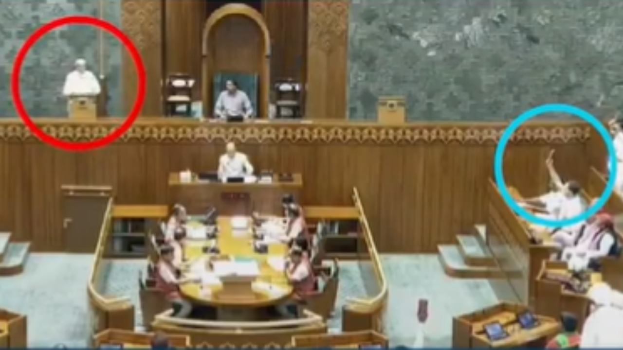 Rahul holds up a copy of Constitution while PM takes oath