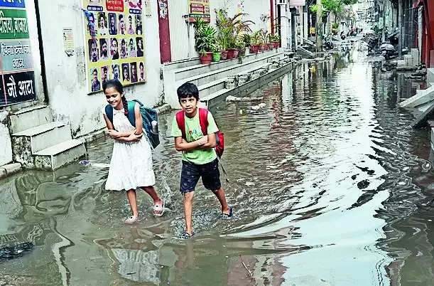 Choked drain leads to flooded streets & flared tempers in city
