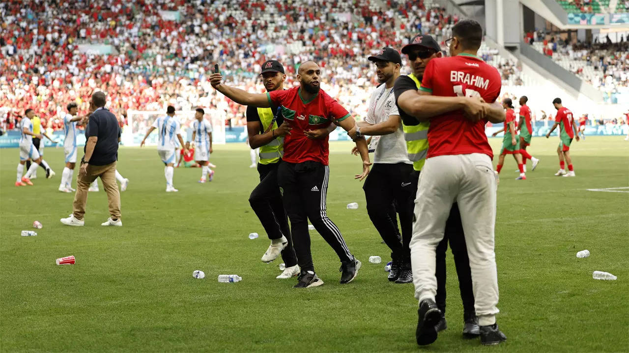 Watch: Olympic football kicks off to violent and chaotic start