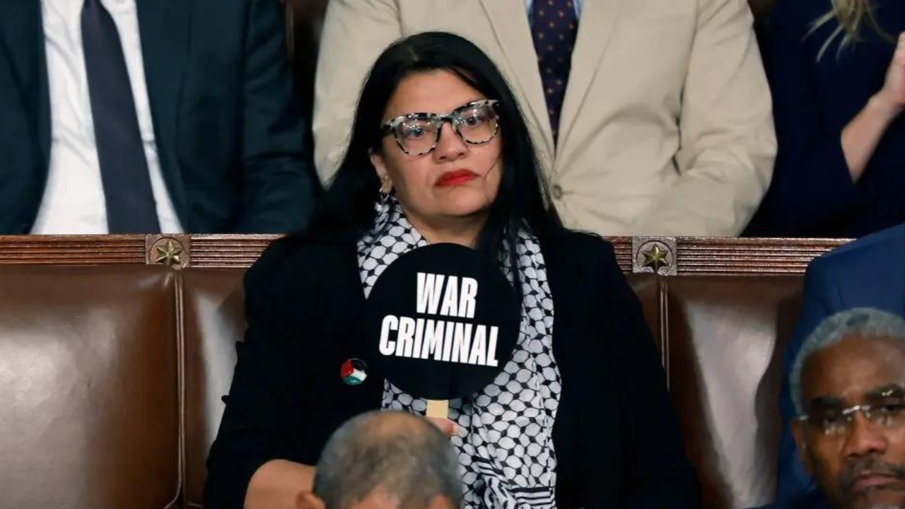 Placard reading 'war criminal', 'guilty of genocide' shown by US lawmaker during Netanyahu's speech