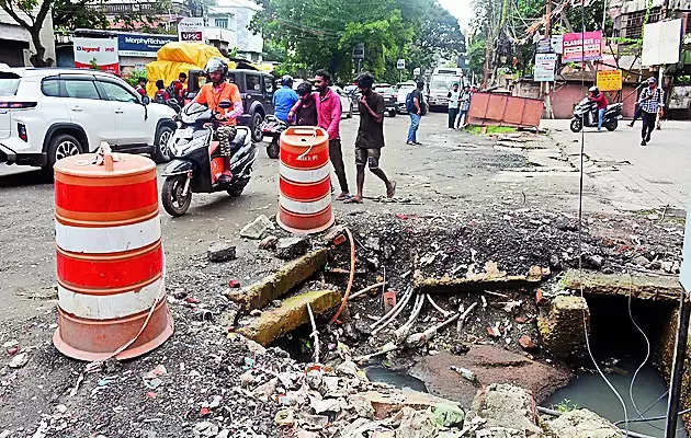 Potholes, overflowing drains worsen condition of city roads