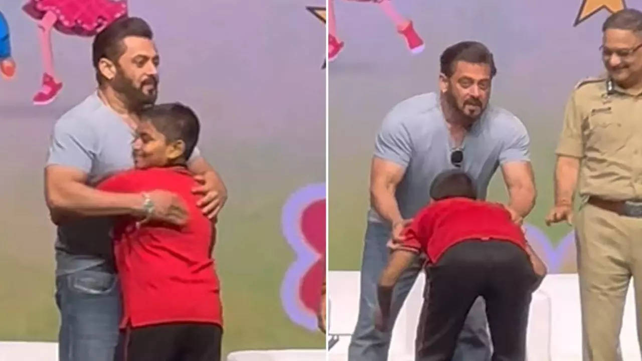 Salman Khan gives a hug to a young fan on stage as he touches his feet at Ganesh Chaturthi event Filmymeet