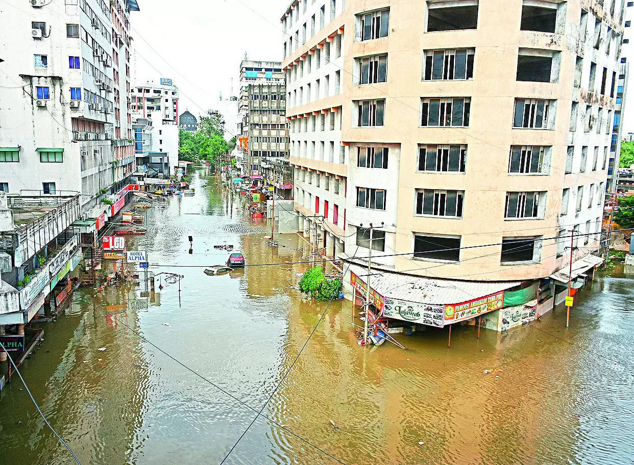 AFTER THE DELUGE, CITY LIMPS BACK TO NORMALCY