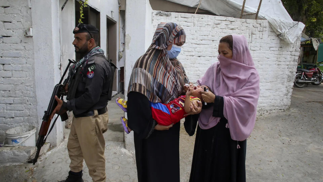 A roadside bomb hits a vehicle carrying police guarding an anti-polio drive in Pakistan, wounding 9