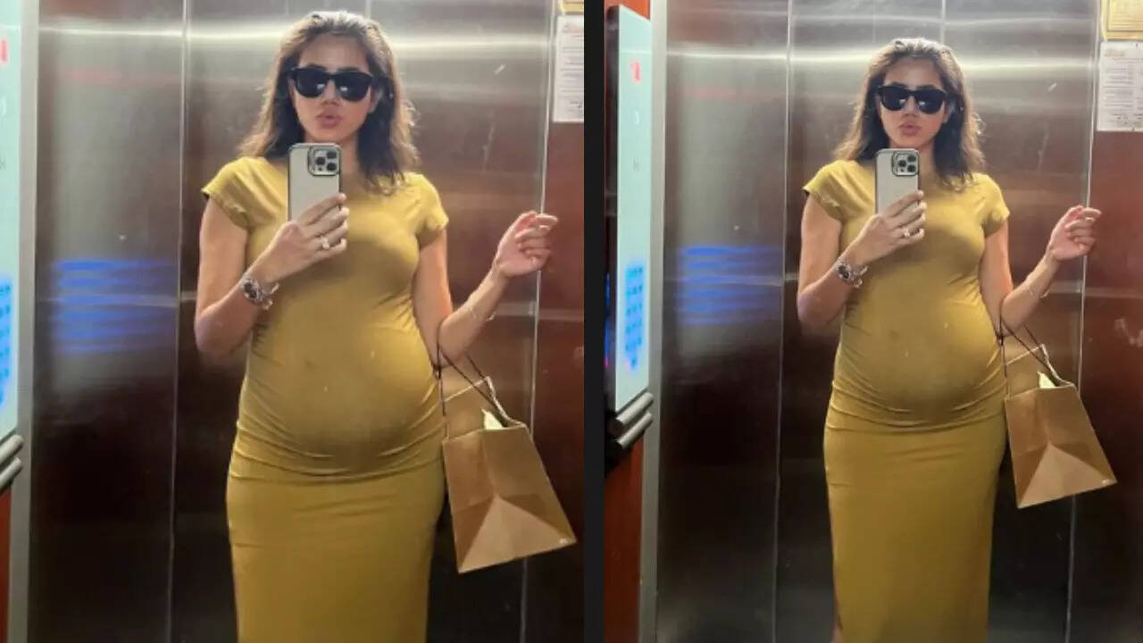 Sonnalli oozes pregnancy glow in a yellow dress