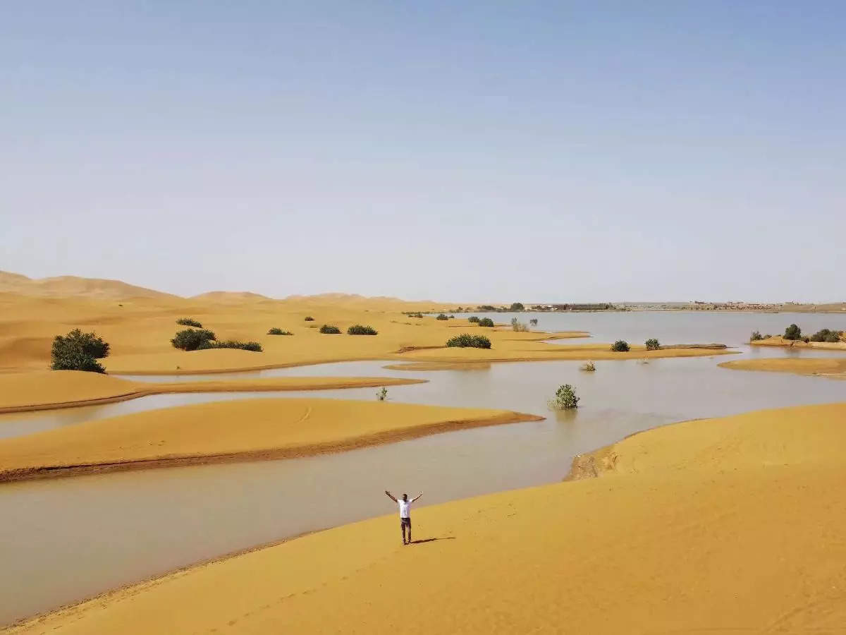 Rare rainfall transforms Sahara Desert, creating blue lagoons amid the sand dunes