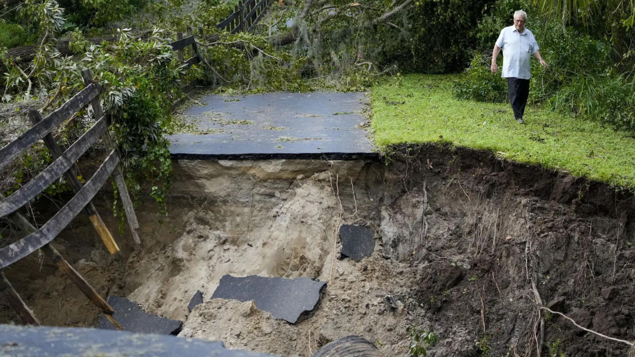 Residents slog through flooded streets, clear debris after Hurricane Milton tore through Florida