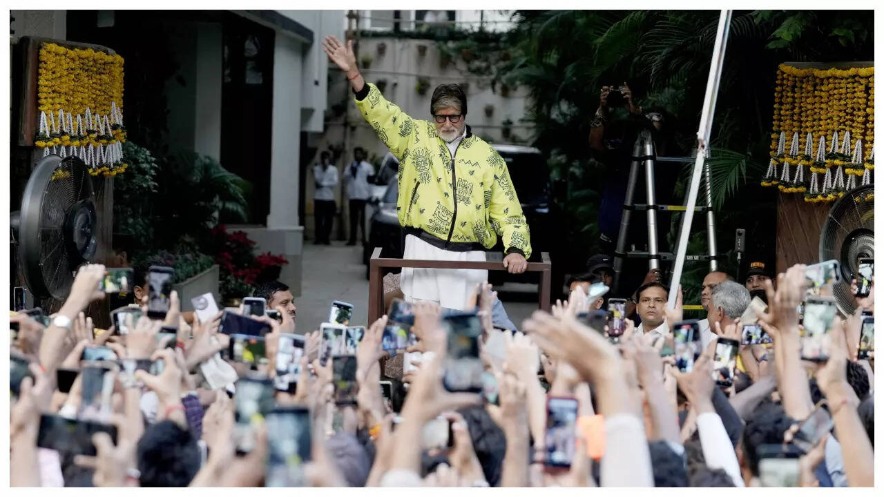 Big B rocks a neon jacket as he greets his fans - Pics