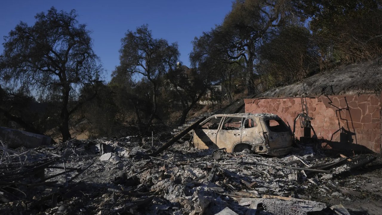 Over 130 homes lost in Calif wildfire; rare brushfire in NY