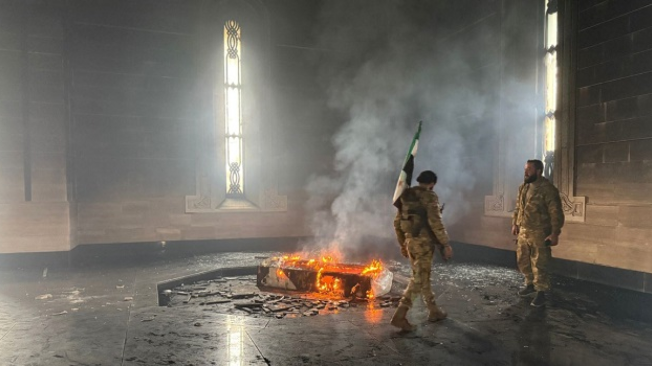 Watch: Syrian rebels torch tomb of Assad's father