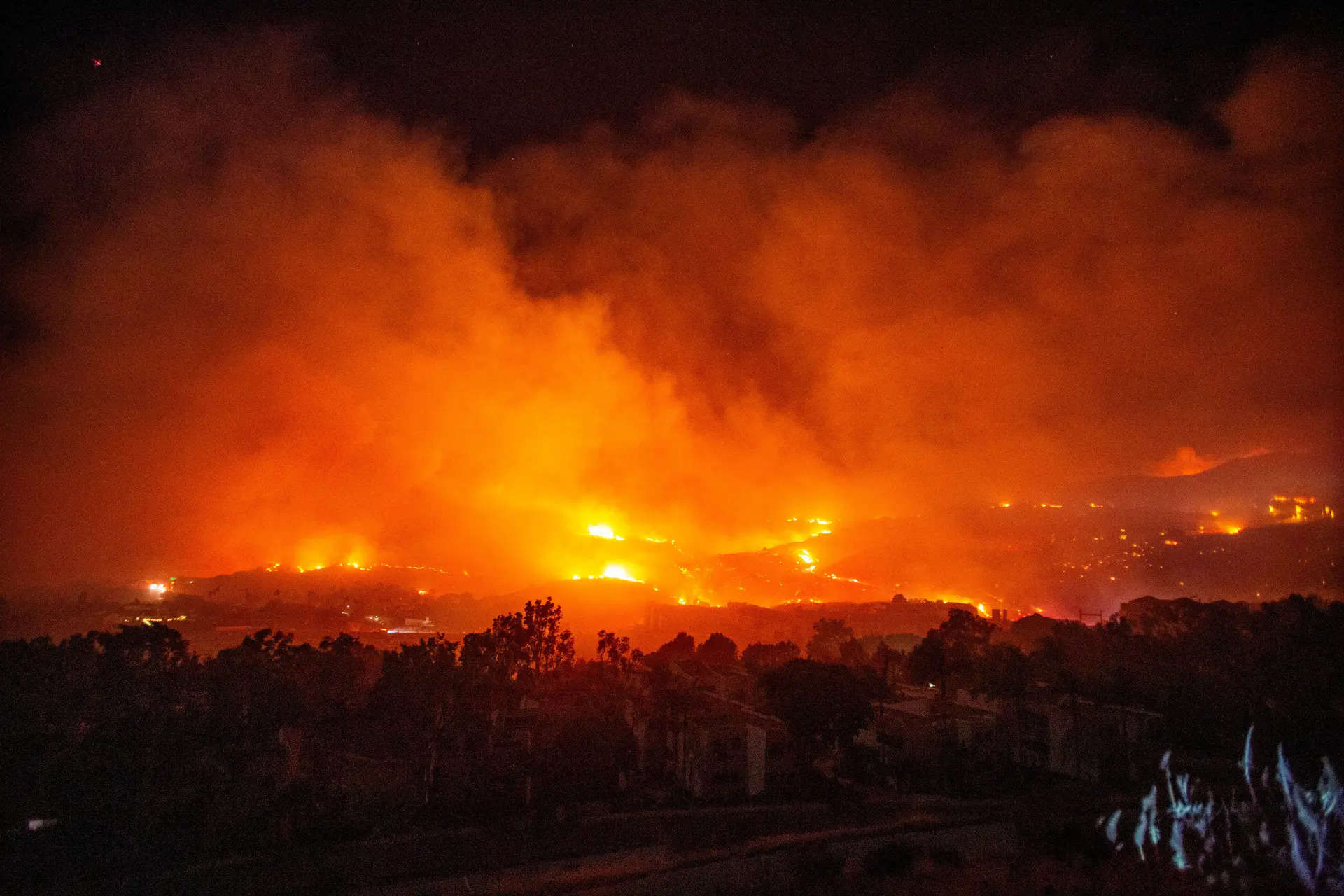 Malibu wildfire is raging out of control as dry winds fan flames