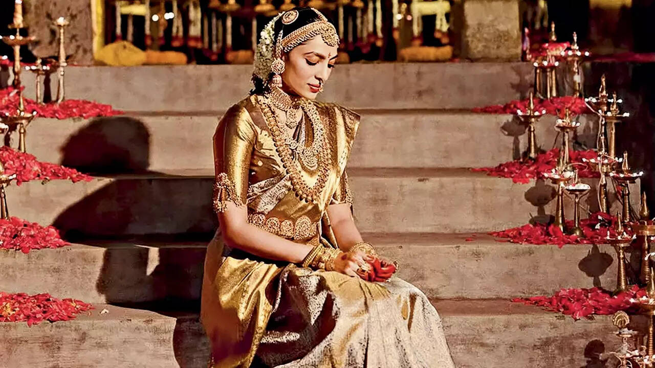 Opt for a metallic or embellished waistbelt that complements the bridal outfit, like a gold or silver kamarbandh paired with a lehenga or sari