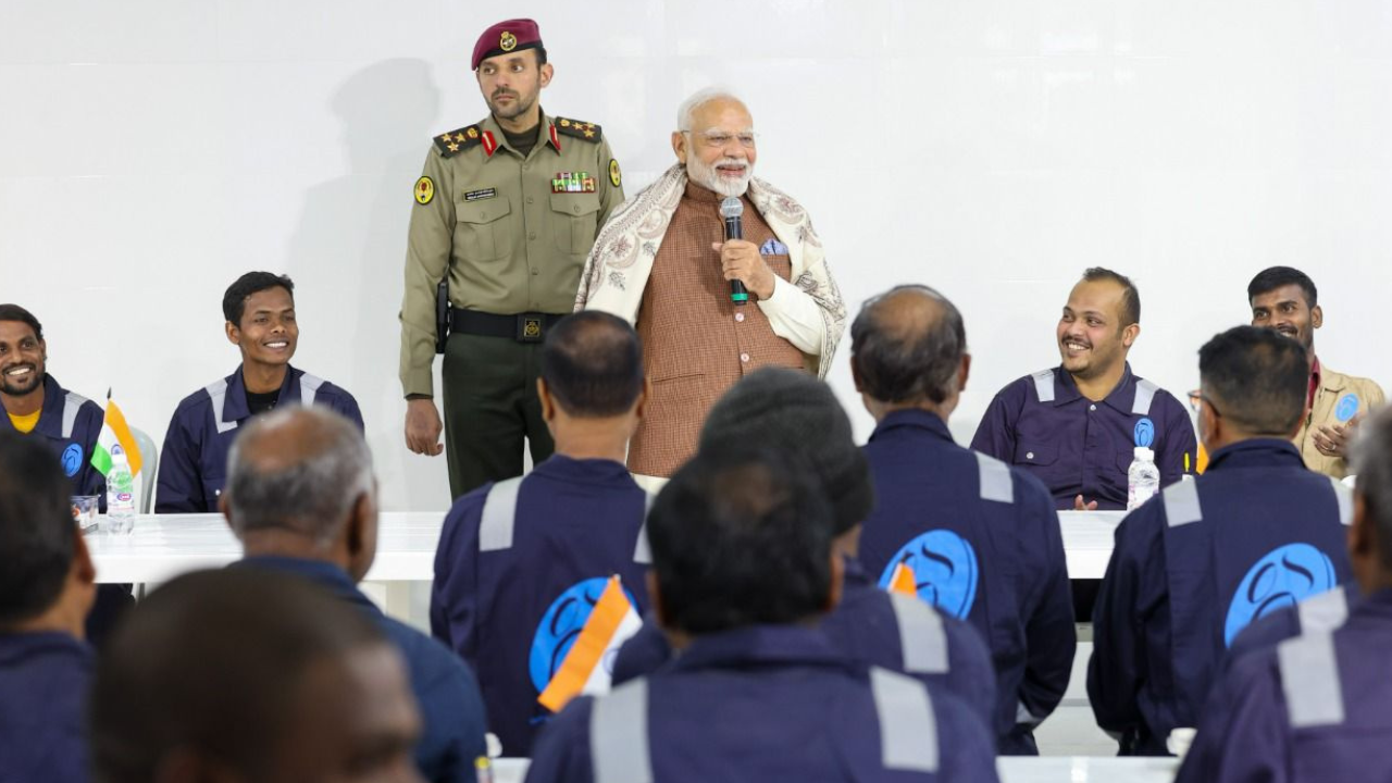 PM Modi meets Indian migrant workers at Gulf Spic Labour Camp in Kuwait