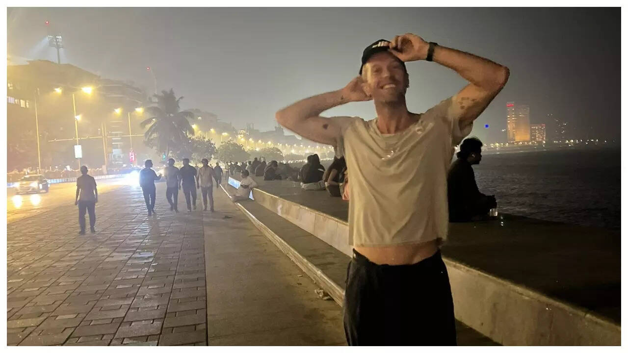 Chris Martin poses for photos on busy Marne Drive