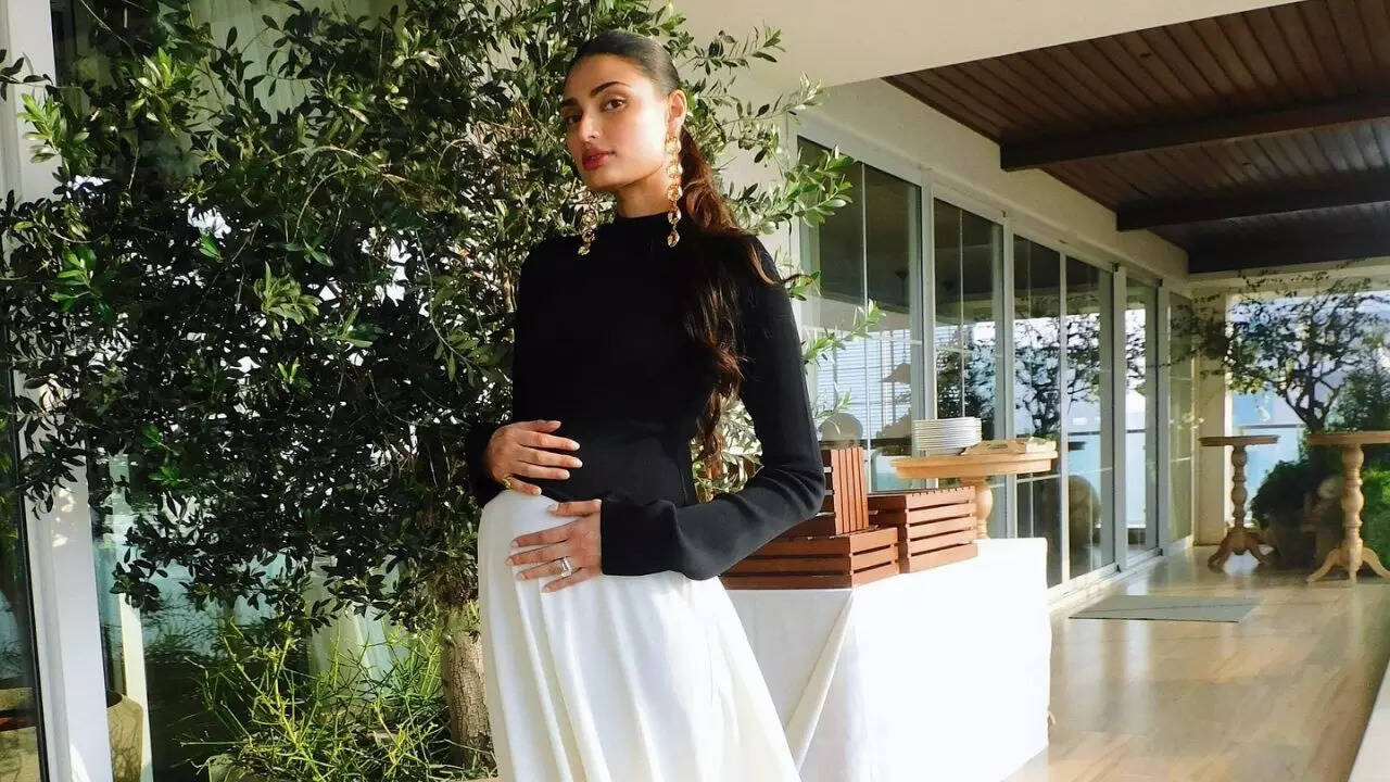 Athiya Shetty cradles her baby bump in new pictures