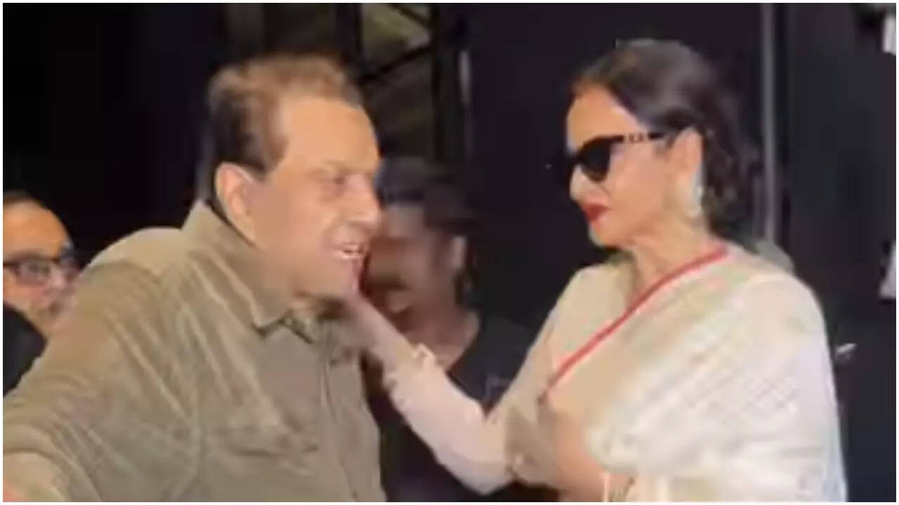 Rekha shares a heartwarming hug with Dharmendra