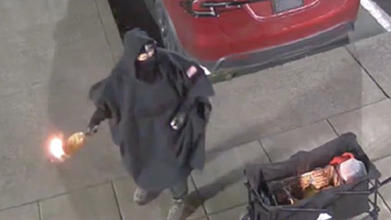 Who is the suspect charged in the Salem Tesla dealership attack?