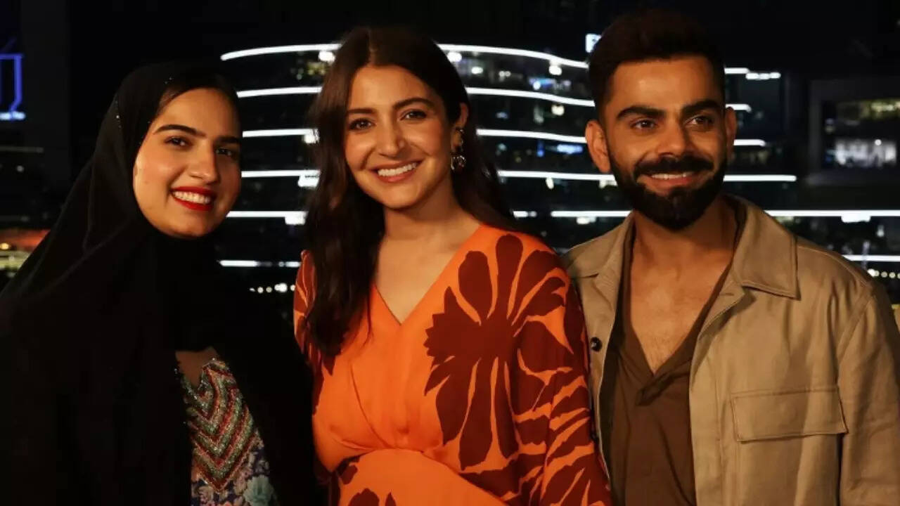 Anushka and Virat Kohli pose with fan in Dubai