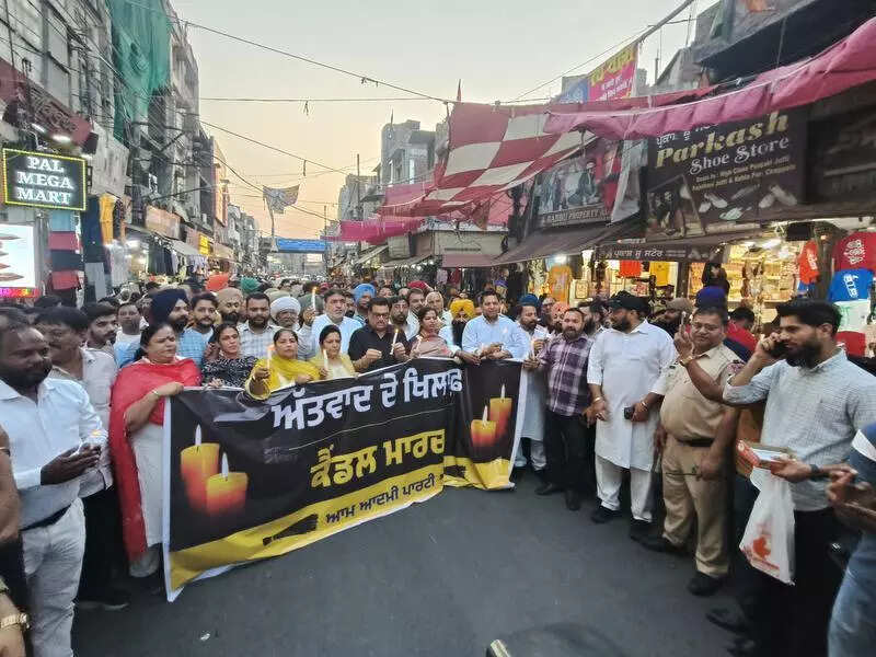 AAP MLAs take out candle light march against attack, demand action from Centre