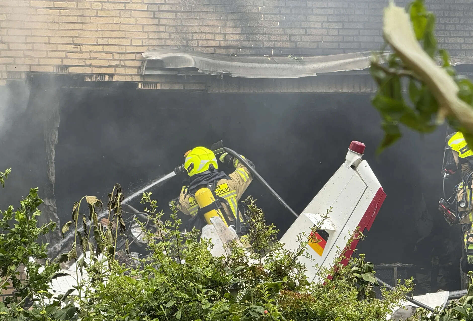 Small plane crashes into residential building in Western Germany, two dead