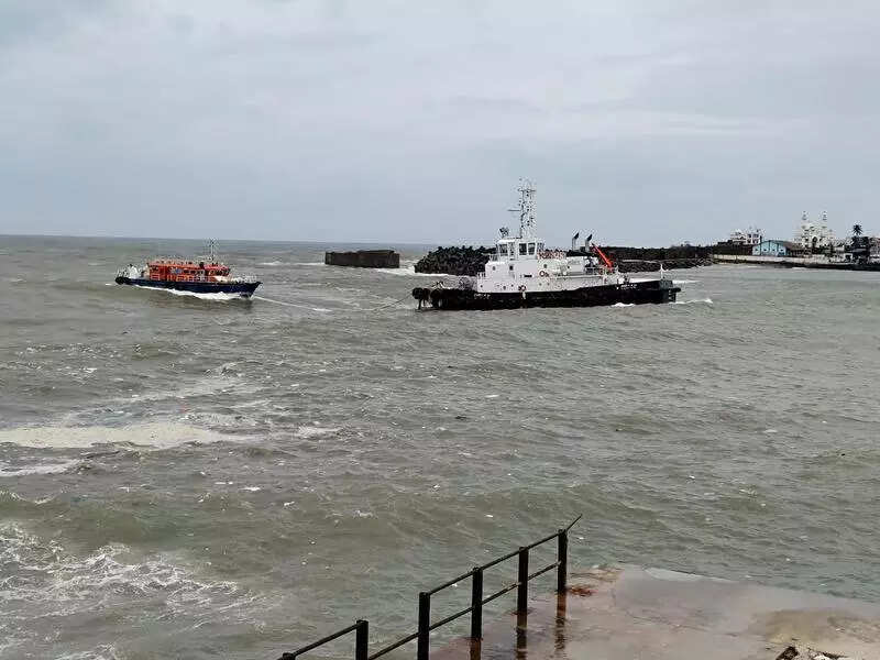 Vizhinjam port tugboat tows stranded marine enforcement vessel to safety in rough seas