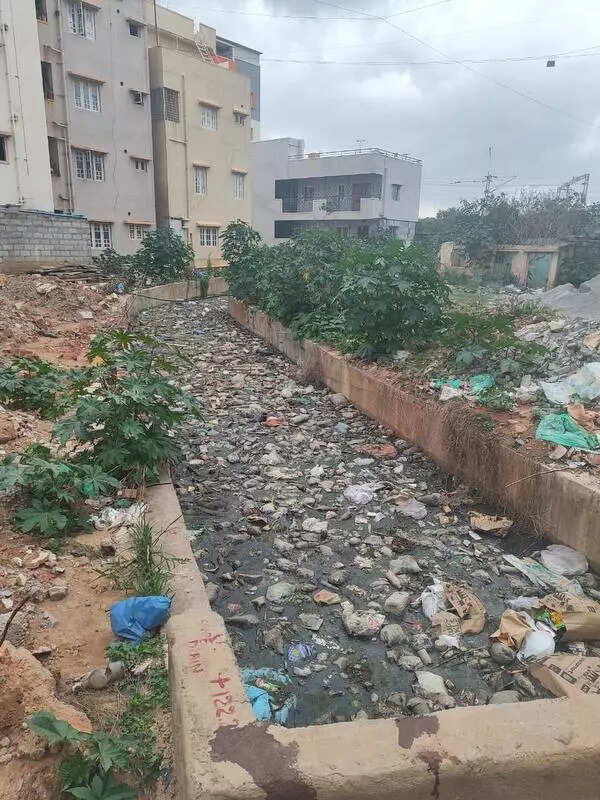 Open drain in Munnekolala sparks safety and health concerns; Residents demand urgent action from Bengaluru civic agency