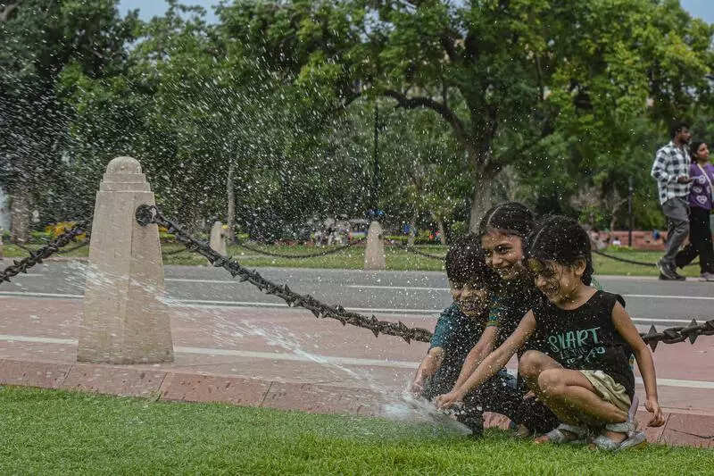 Day after monsoon onset, cloudy skies and rain cool city