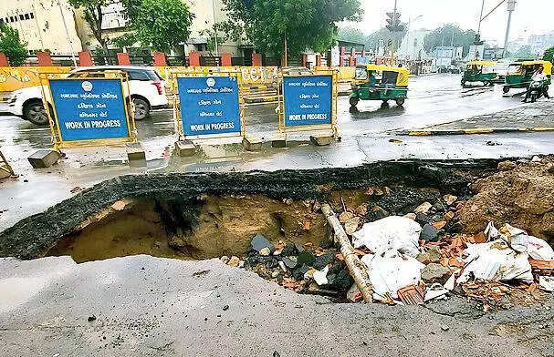 Ahmedabad Municipal sign foretells road collapse, rain delivers