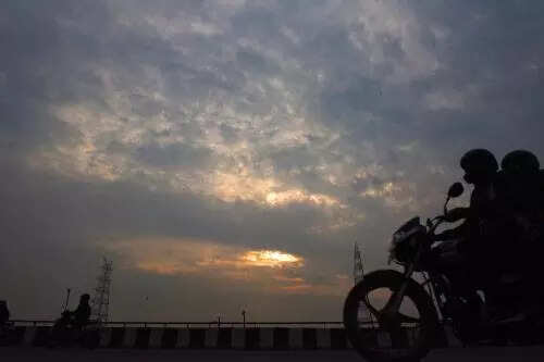 Hot and humid weather in delhi with light rain