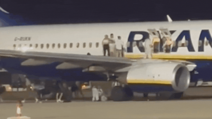 Panic at Spain Airport: Ryanair passengers leap from wing after fire alert