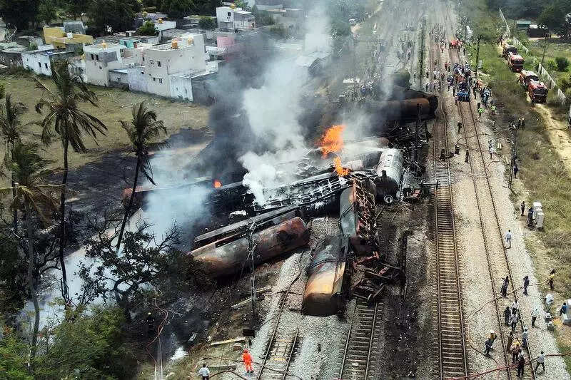 Spark in overhead equipment may have ignited fuel leaking from derailed wagon