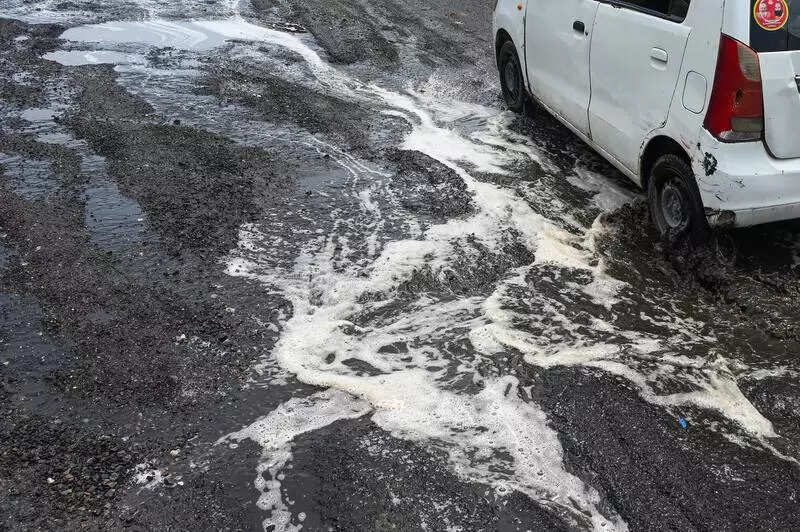 Monsoon traffic nighmare unfolds on Savitri flyover with half-done repairs