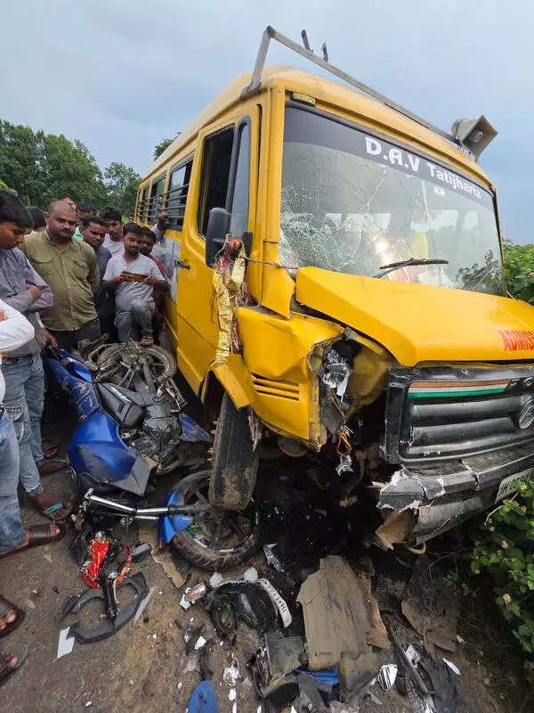 One dead, 2 injured in school van, bike collision