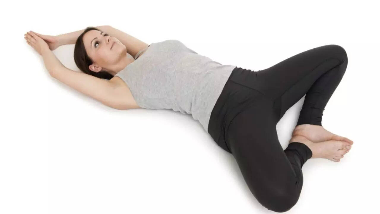 Supta Baddha Konasana (Reclining Bound Angle Pose):