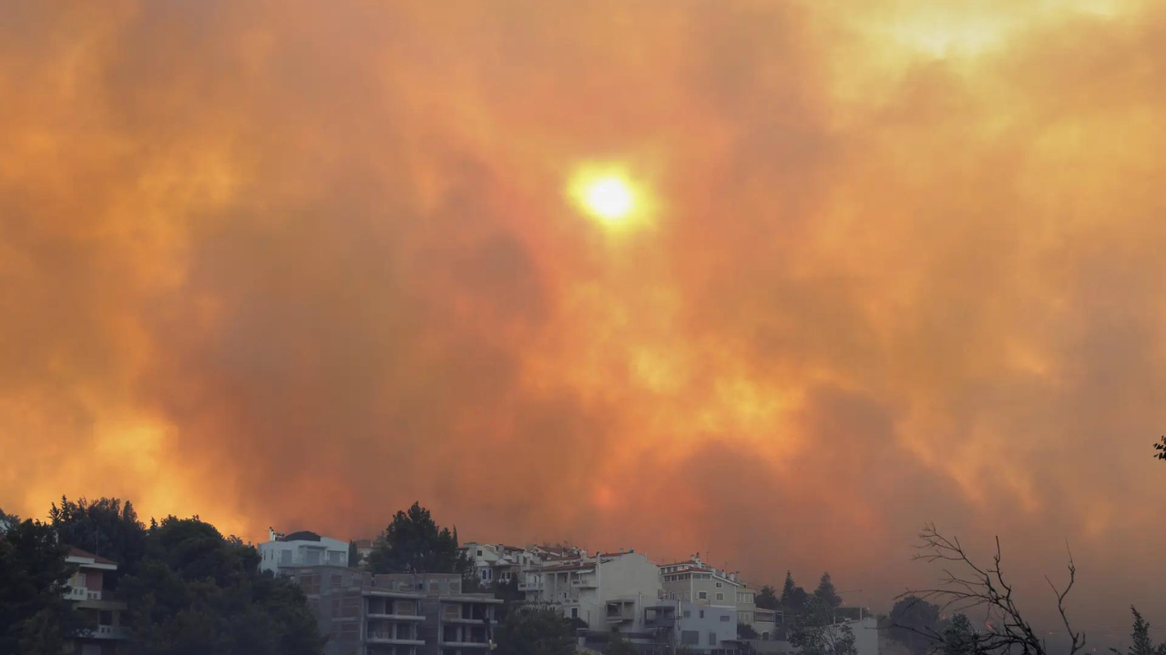 Wildfire burns through northern suburb of Greece's capital Athens and residents are told to evacuate