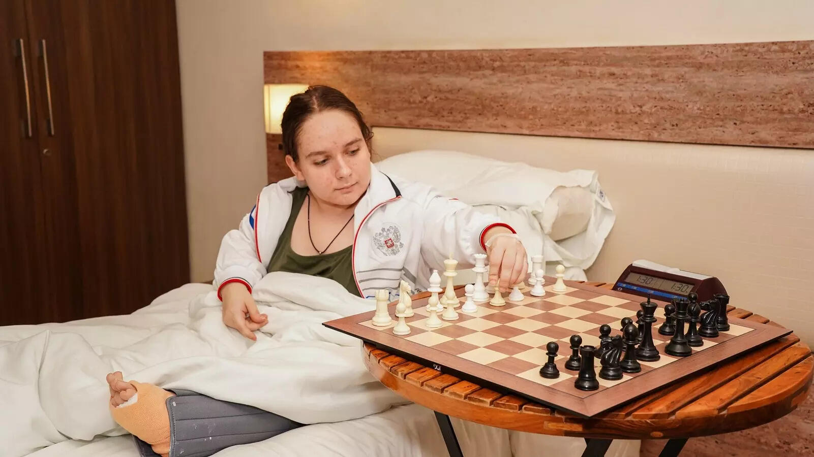 After surgery, Russian teenager returns to compete from her bed, wins both rounds