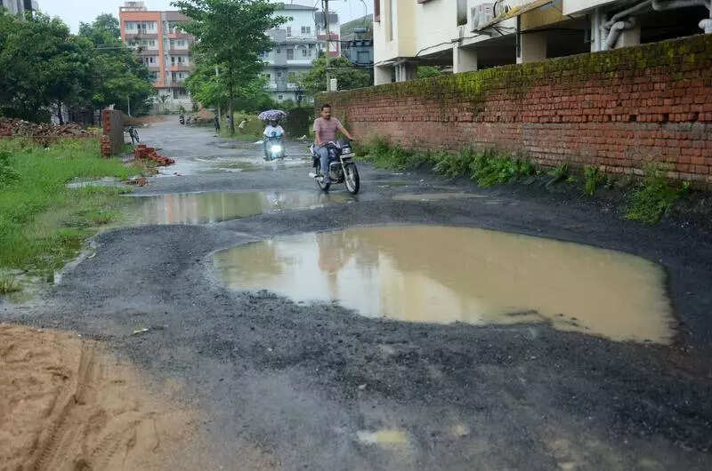 No idea where pothole ends & road begins: Commuters
