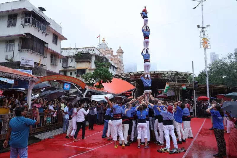 Spanish child castellers form human pyramid in Siddhivinayak temple courtyard