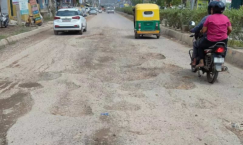 Craters, debris & stagnant sewers: Commute a nightmare on this Gurgaon road