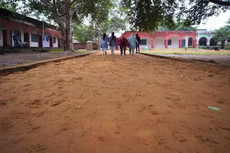 Governer visiting, students asked to fill up potholes at a govt school’s entrance in Gurgaon