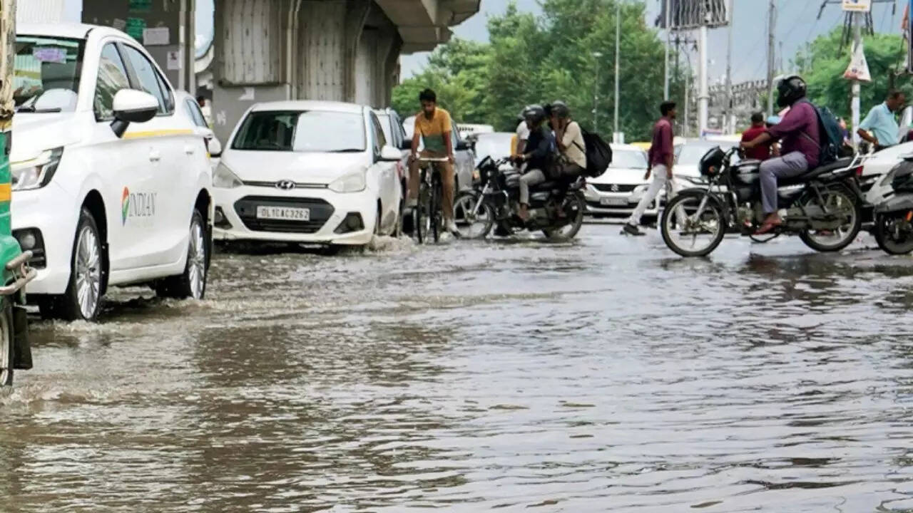 Drenched & defiant: 10 Unforgettable images from Gurgaon’s rain havoc