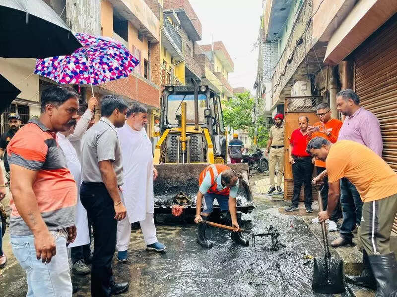 City streets smothered by sludge; rain dampens cleaning efforts