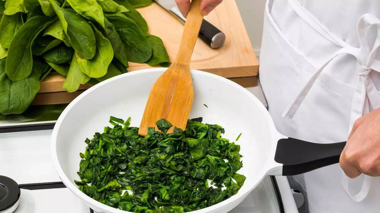Season spinach with salt at the end